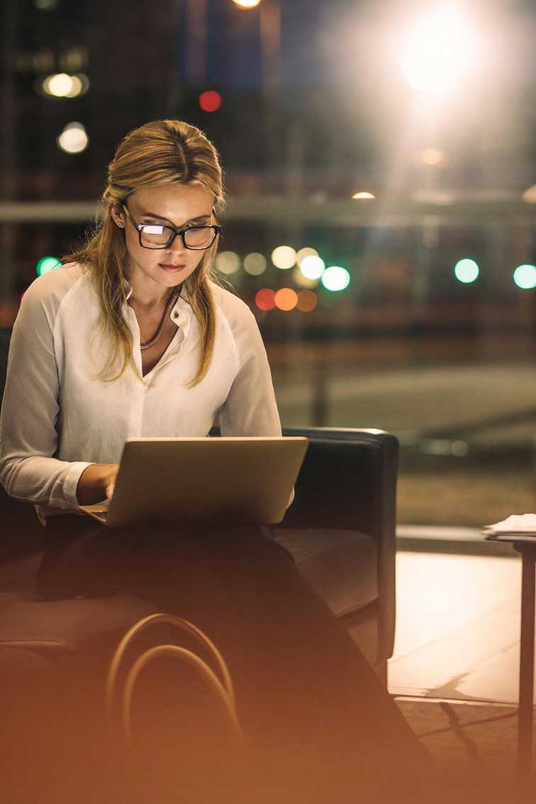 A professional concentrating on her work in an office